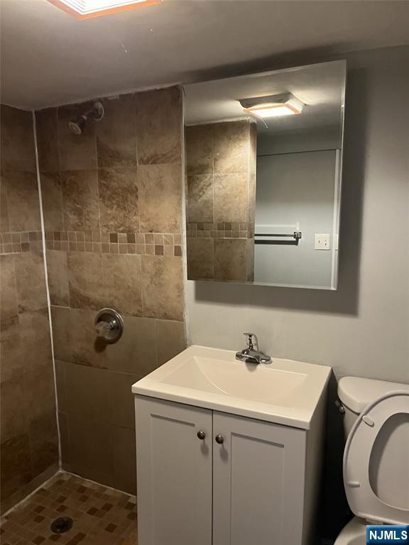 84-86 Main Street, Unit 1 Paterson, NJ 07505 - Photo 10 of 10 a bathroom with a sink a toilet and shower