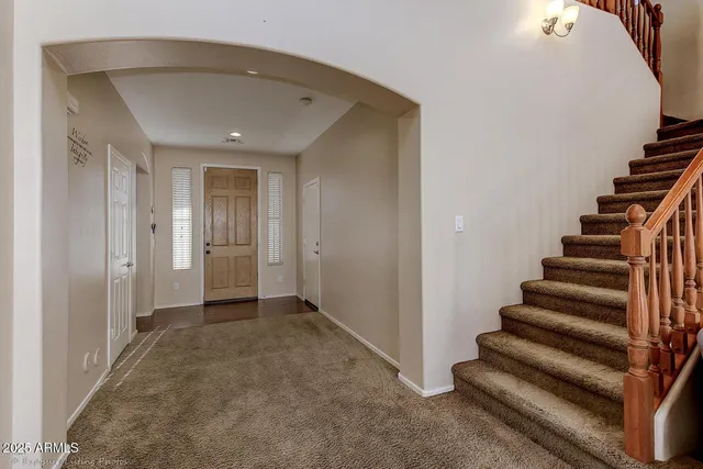 a living room with furniture a couch and a window