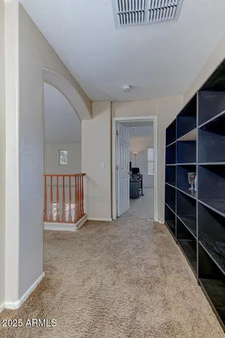 a bed room with a bed and a ceiling fan