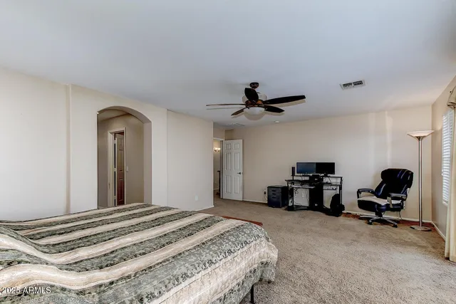 a spacious bathroom with a tub shower and sink