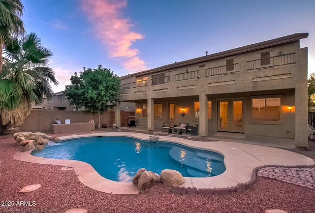 a view of a chairs and table in the patio