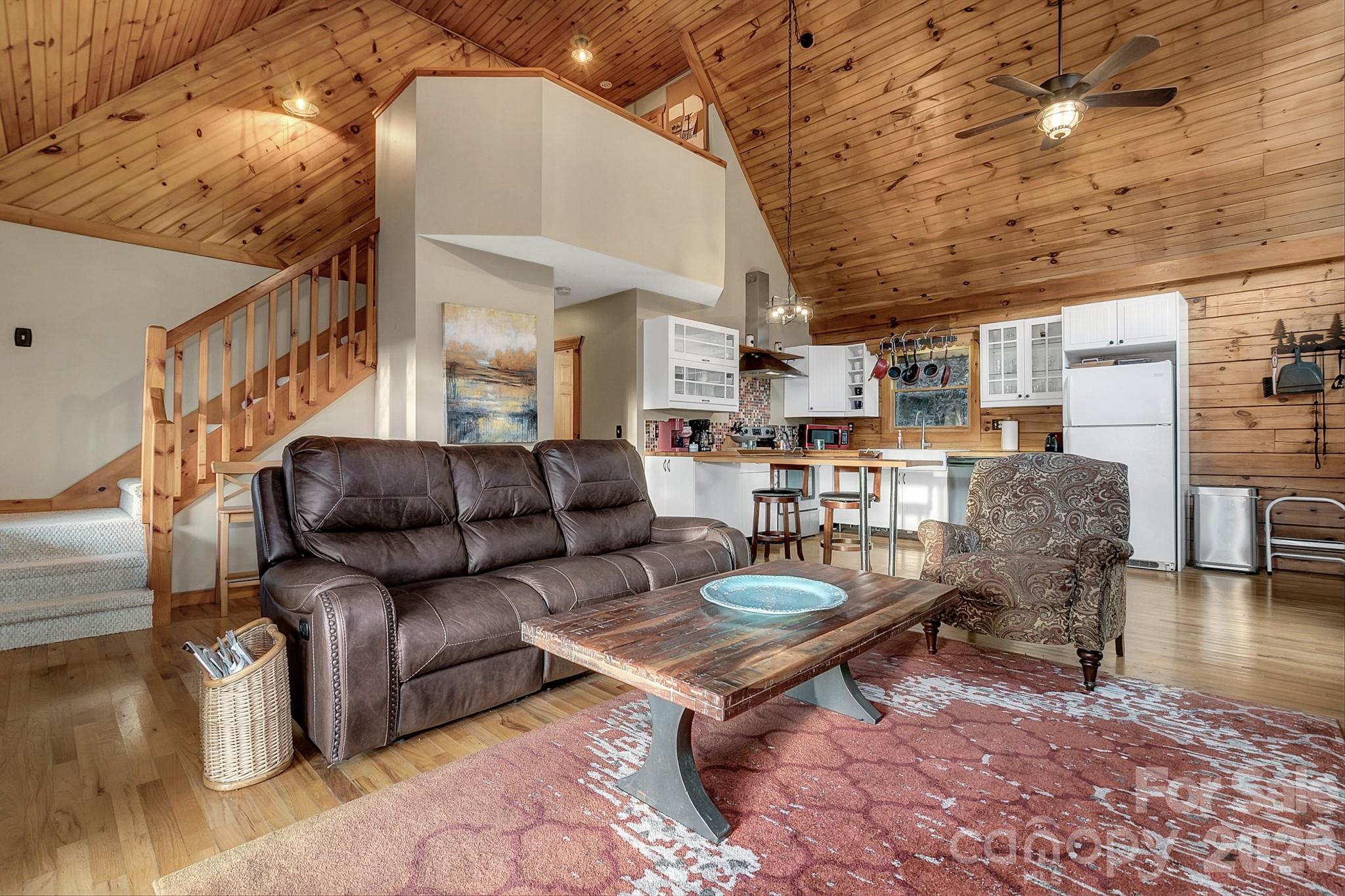 135 Pretty Ridge Maggie Valley, NC 28751 - Photo 16 of 46 a living room with furniture and a fireplace
