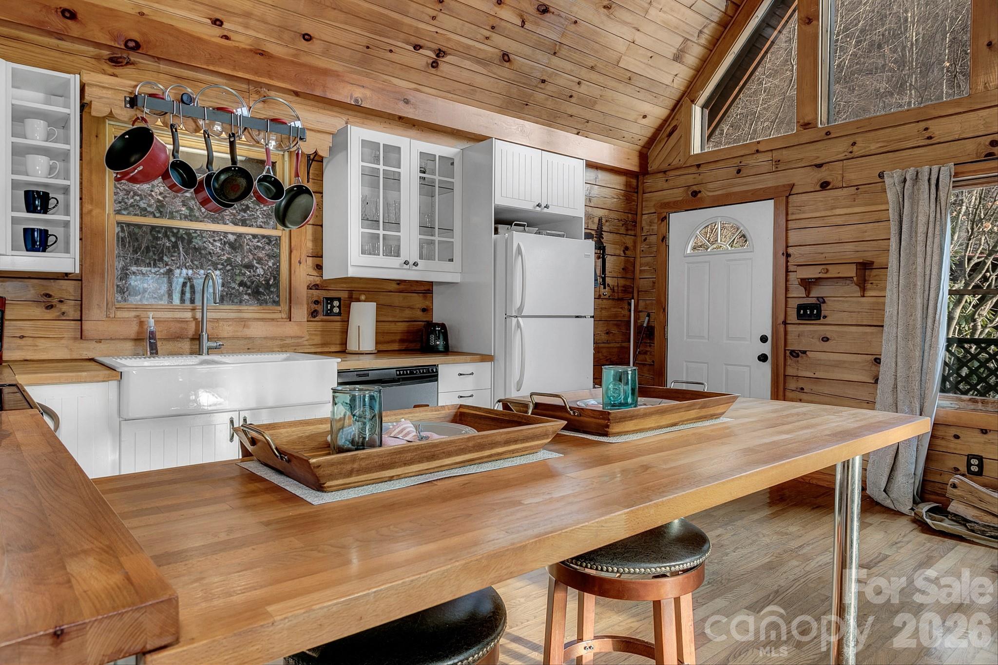 135 Pretty Ridge Maggie Valley, NC 28751 - Photo 25 of 46 a kitchen with a table and chairs in it