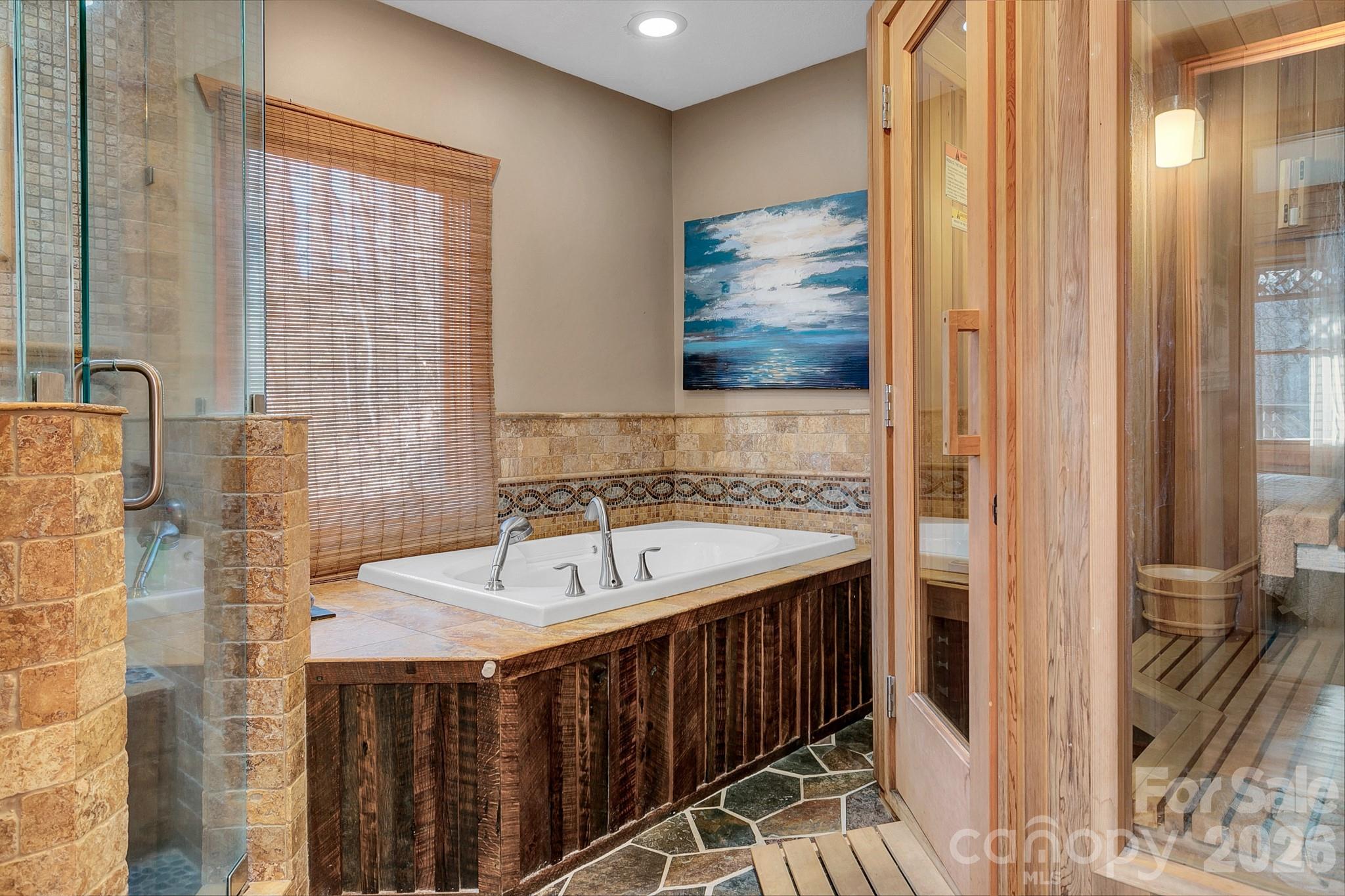 135 Pretty Ridge Maggie Valley, NC 28751 - Photo 27 of 46 a bathroom with a sink and a mirror
