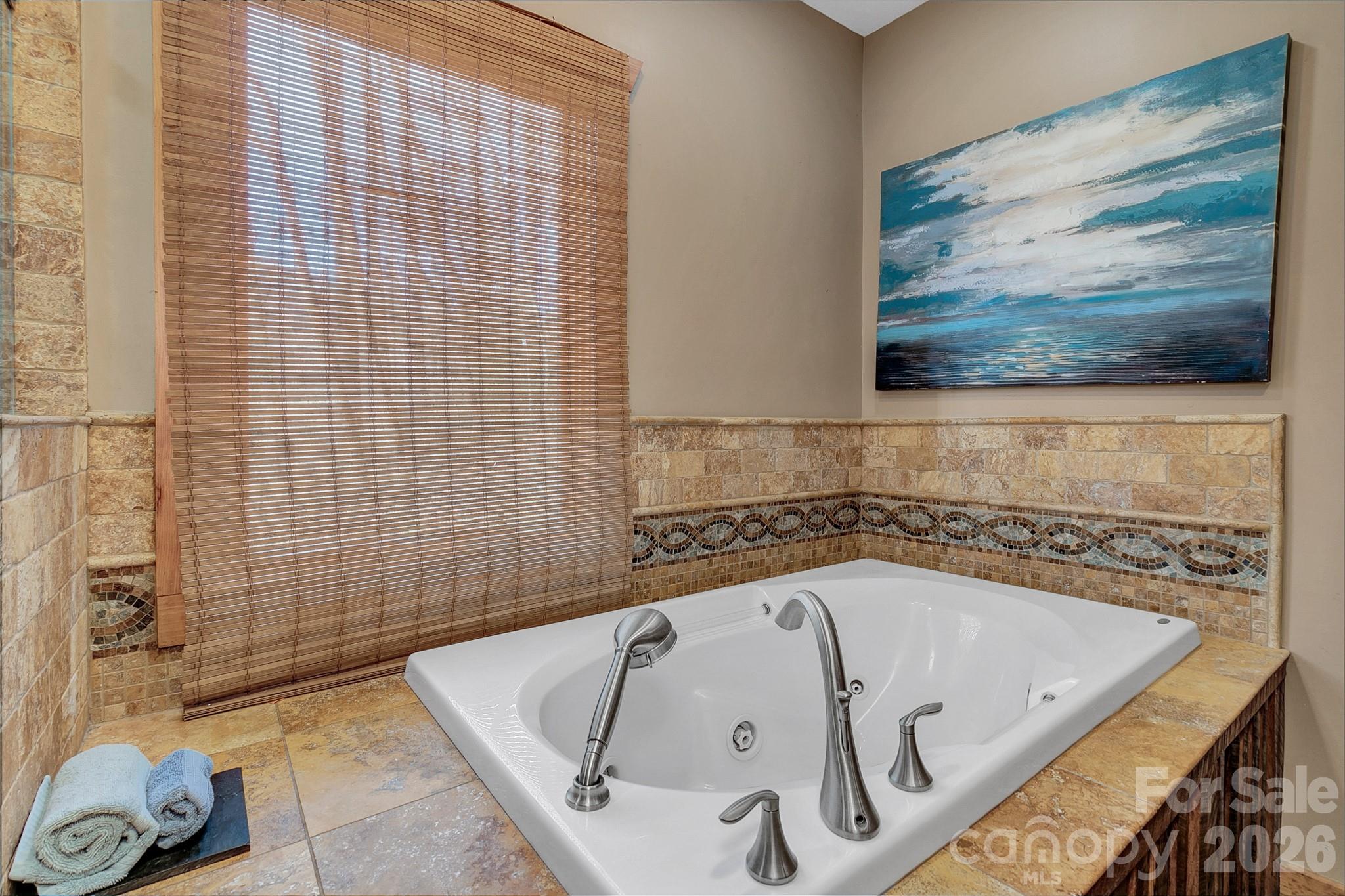 135 Pretty Ridge Maggie Valley, NC 28751 - Photo 28 of 46 a bathroom with a bathtub and shower