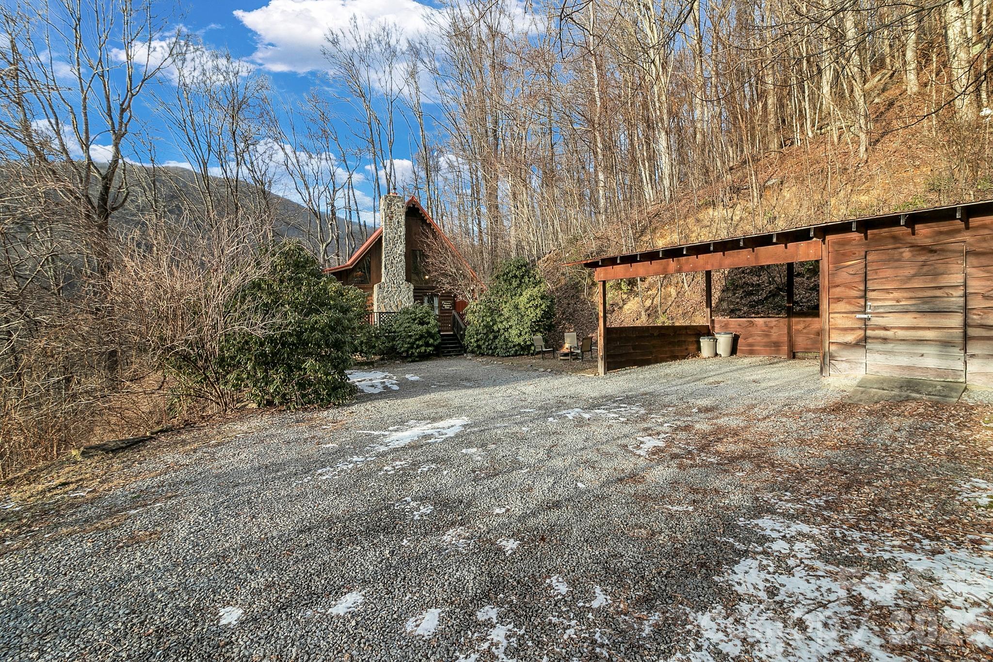 135 Pretty Ridge Maggie Valley, NC 28751 - Photo 3 of 46 a view of a house with backyard and trees