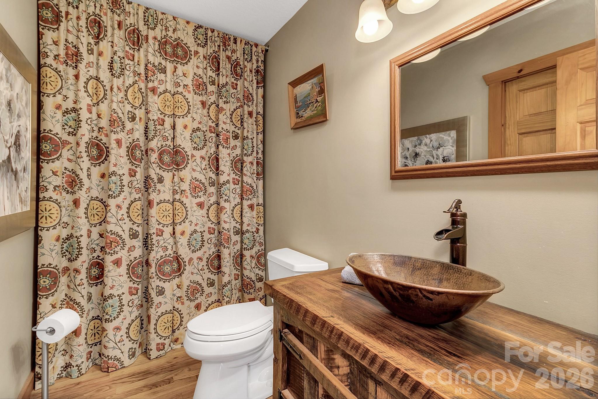135 Pretty Ridge Maggie Valley, NC 28751 - Photo 37 of 46 a bathroom with a granite countertop sink and a mirror