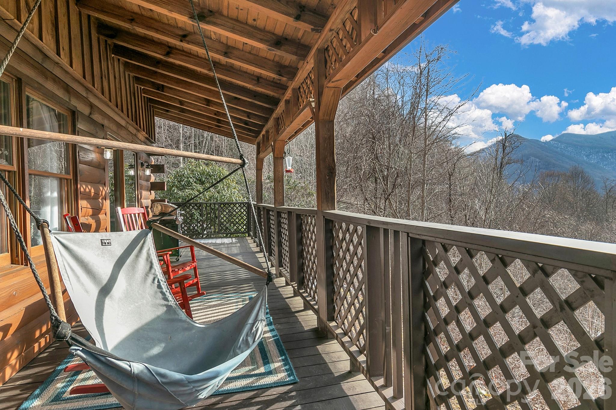 135 Pretty Ridge Maggie Valley, NC 28751 - Photo 8 of 46 a view of a balcony with chairs