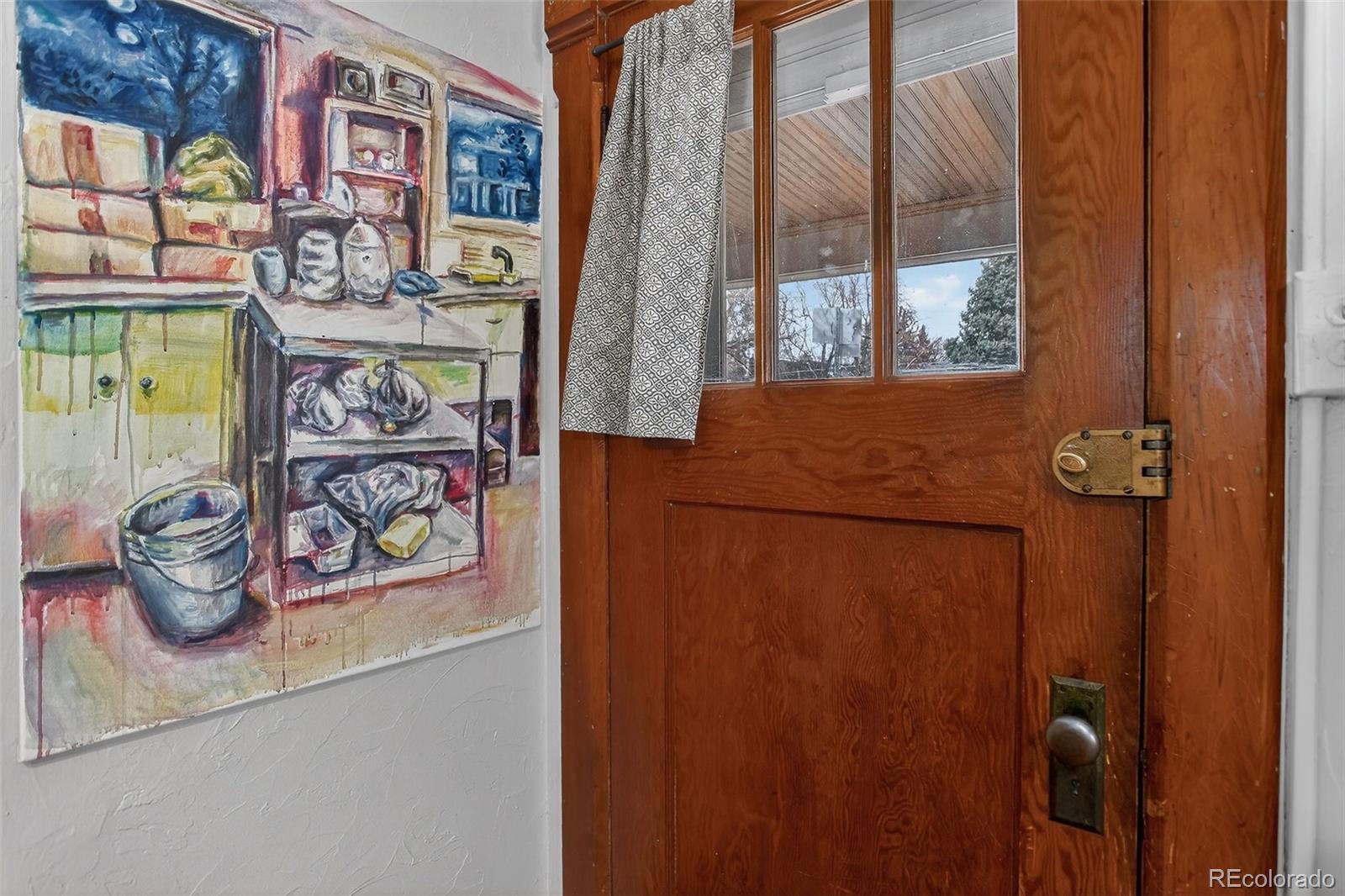 1902 Grove Street Boulder, CO 80302 - Photo 7 of 38 a bathroom with a refrigerator and a window