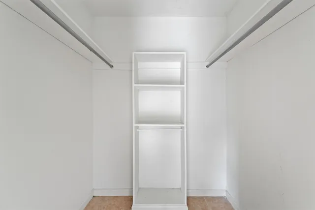 a view of an empty walk in closet