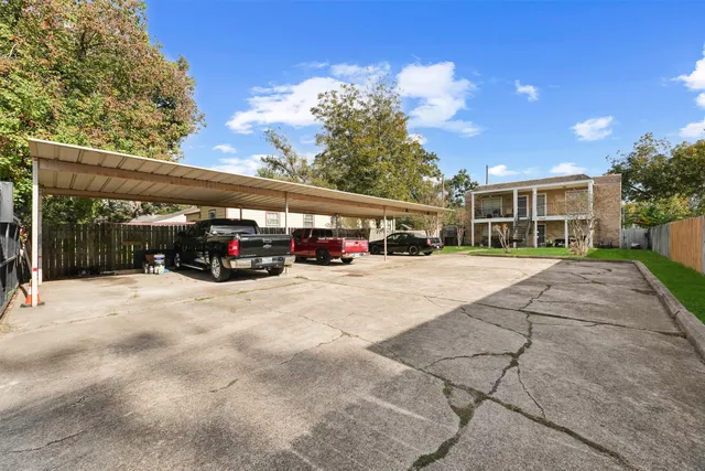 a view of street with parked cars