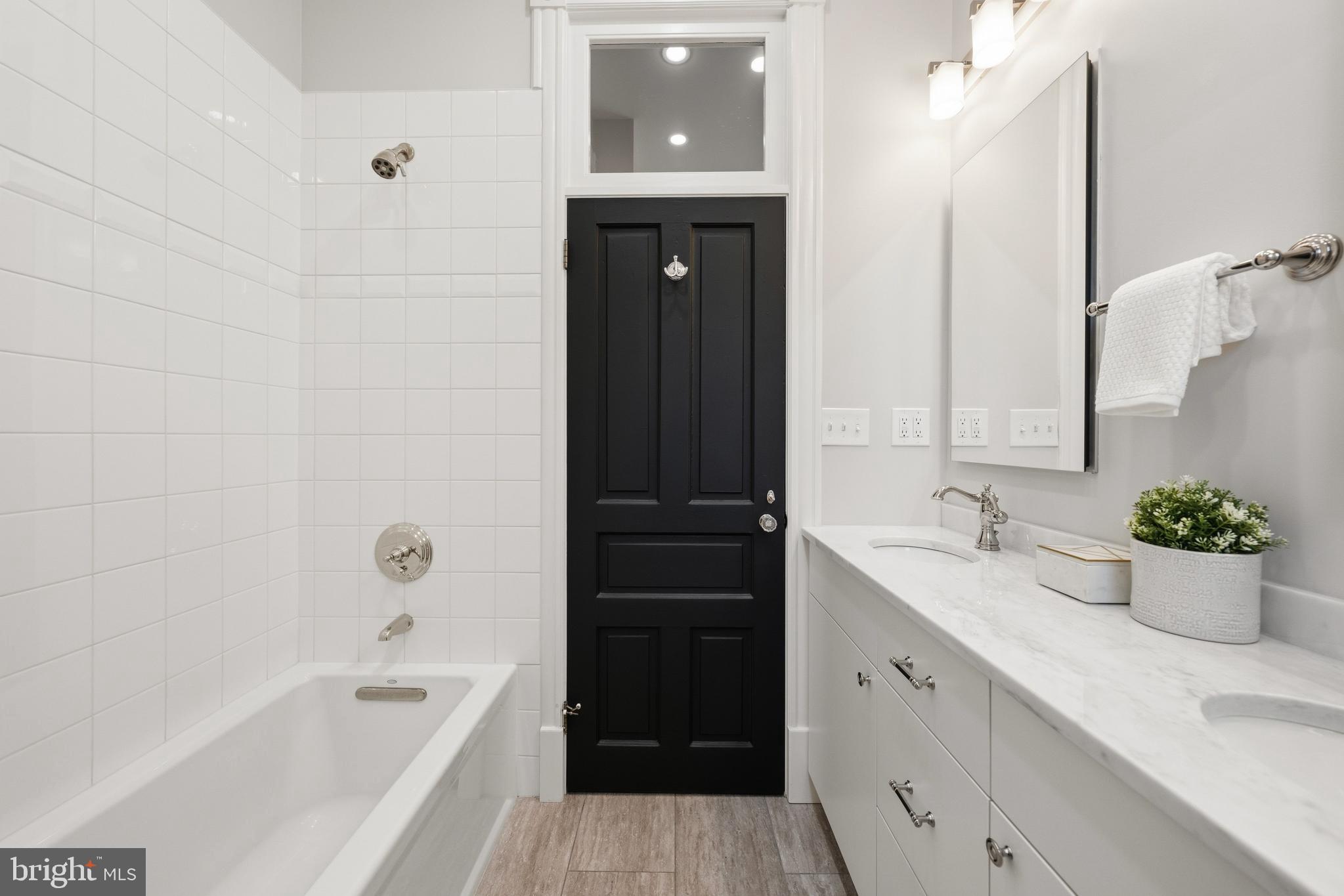 3420 P Street Northwest Washington, DC 20007 - Photo 17 of 32 a bathroom with a tub sink and mirror