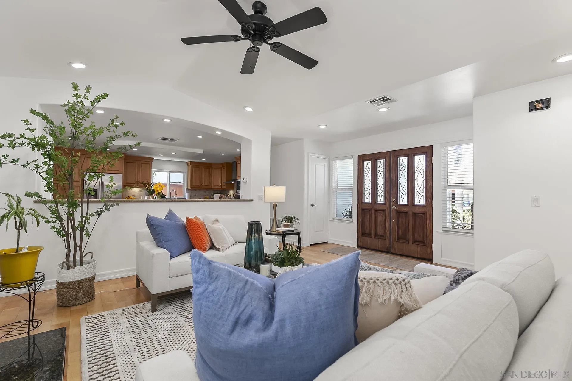10371 Strathmore Drive Santee, CA 92071 - Photo 11 of 58 a living room with furniture and a view of kitchen