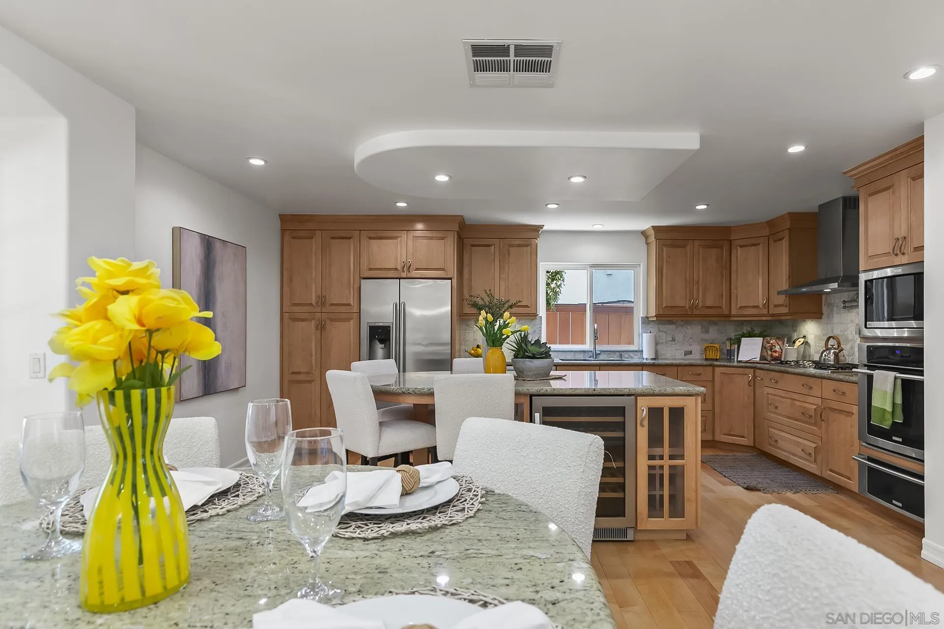 10371 Strathmore Drive Santee, CA 92071 - Photo 15 of 58 a kitchen with a table chairs and kitchen view