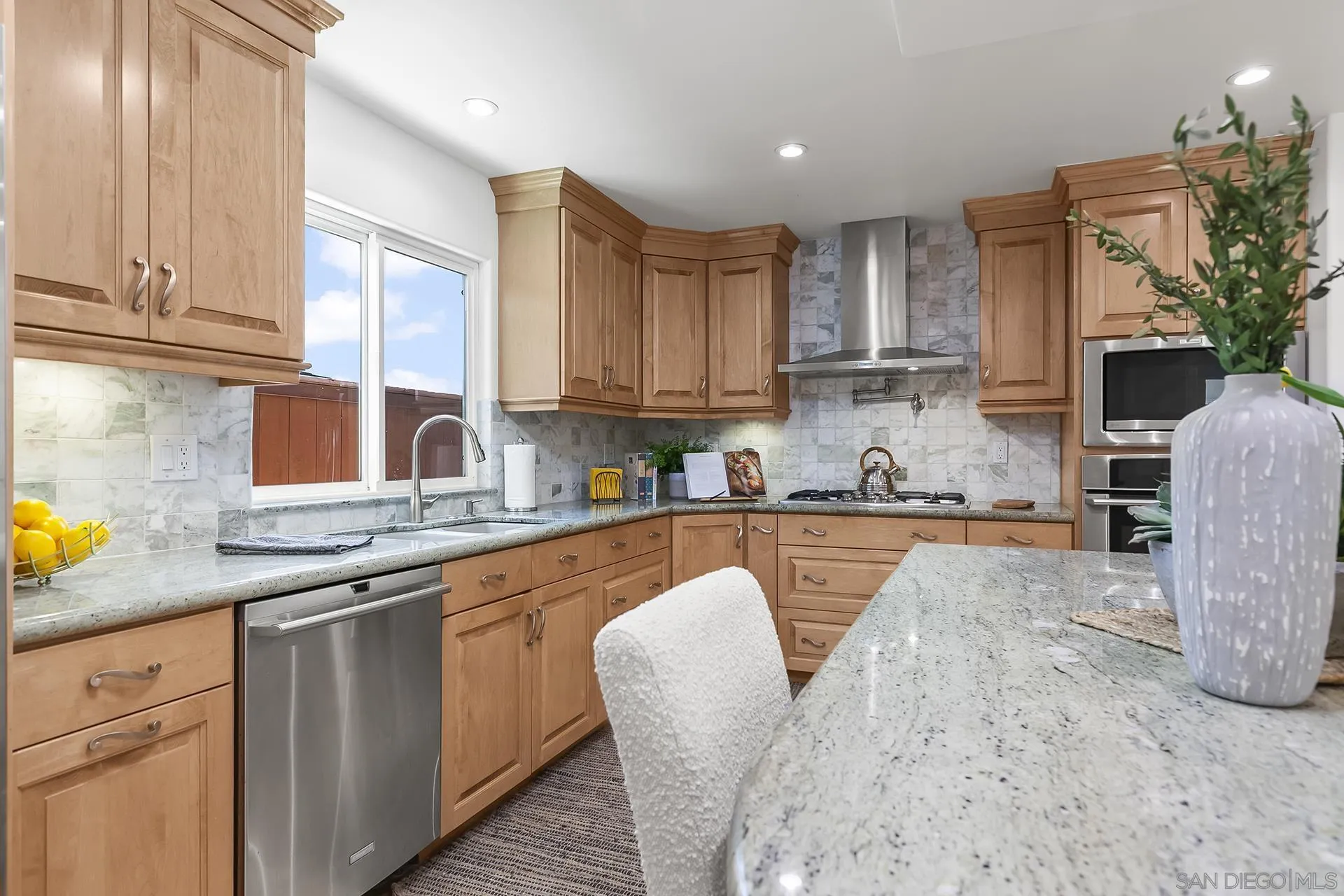 10371 Strathmore Drive Santee, CA 92071 - Photo 22 of 58 a kitchen with stainless steel appliances granite countertop a sink and cabinets