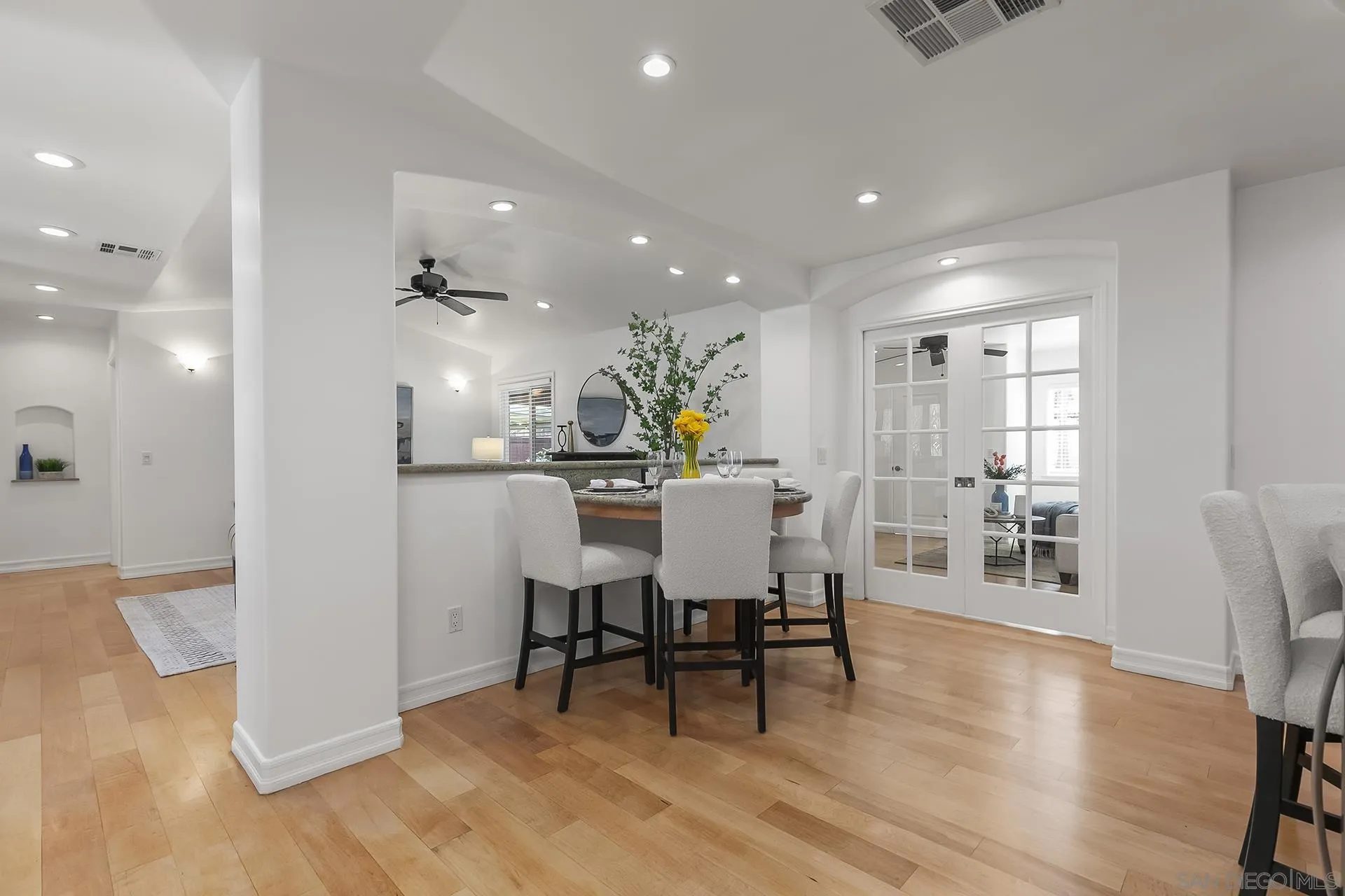 10371 Strathmore Drive Santee, CA 92071 - Photo 23 of 58 a view of a dining room with furniture and wooden floor