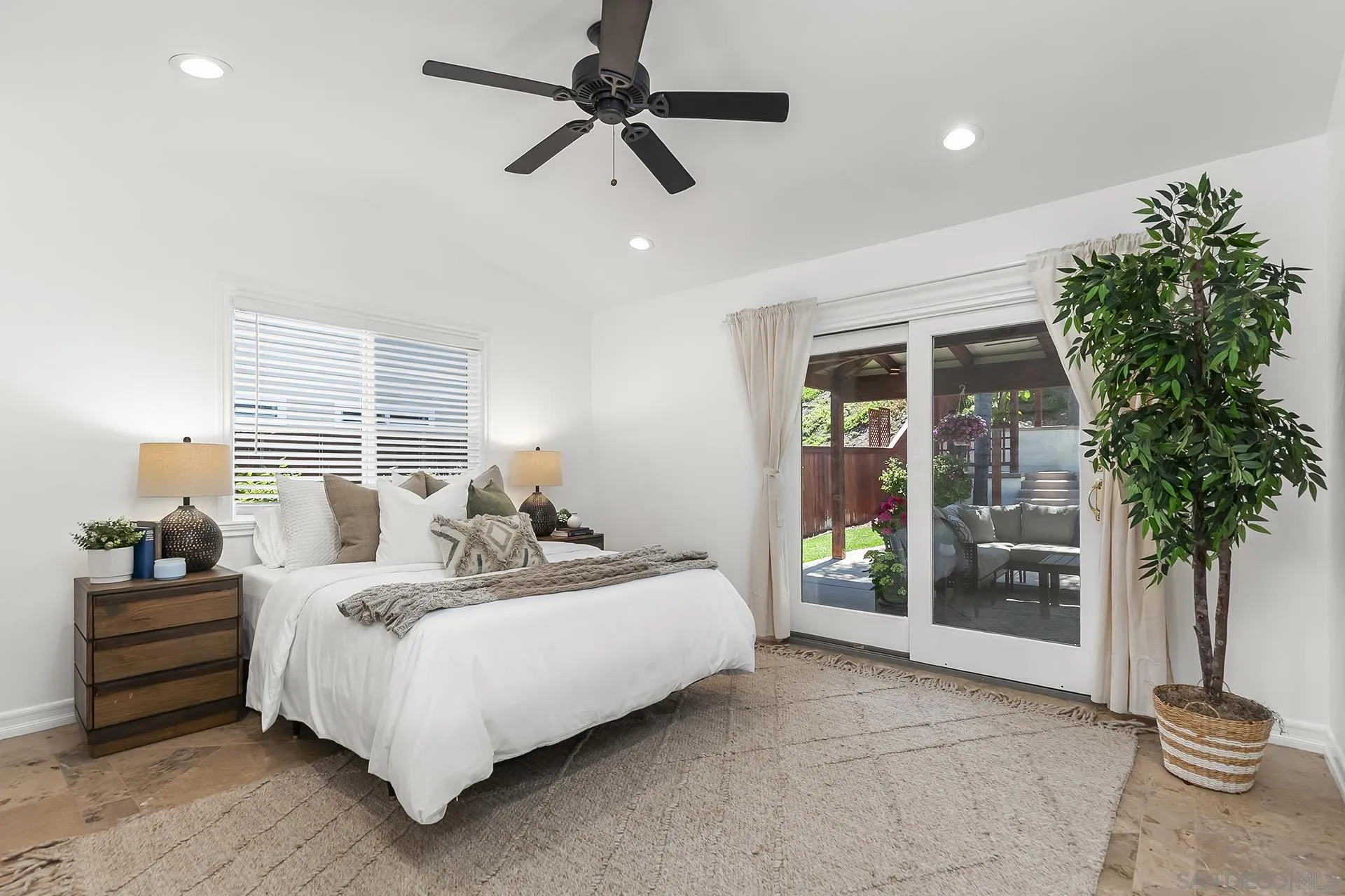 10371 Strathmore Drive Santee, CA 92071 - Photo 24 of 58 a bedroom with a bed and a potted plant