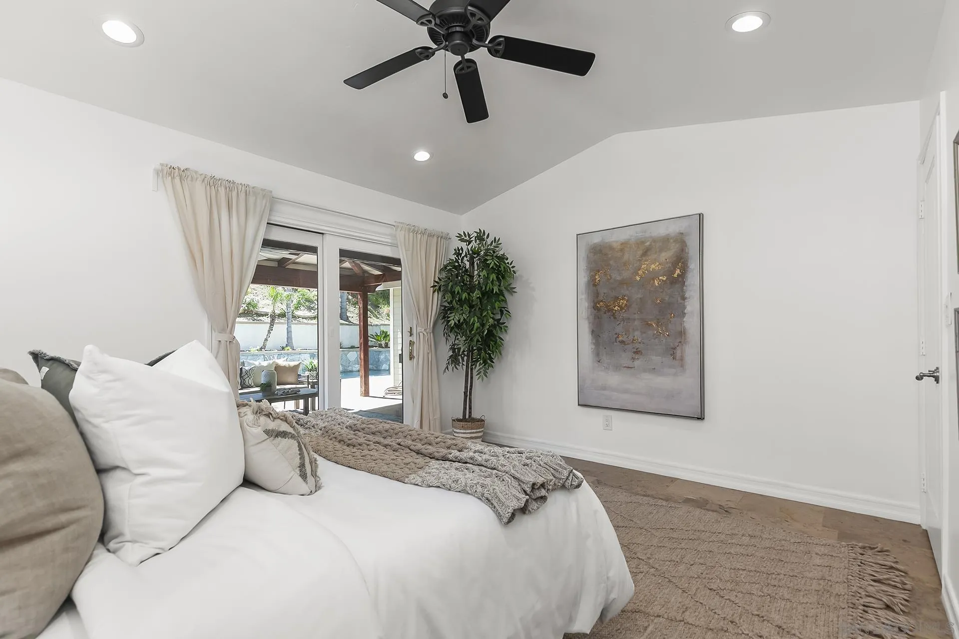 10371 Strathmore Drive Santee, CA 92071 - Photo 25 of 58 a bedroom with a large bed and a window