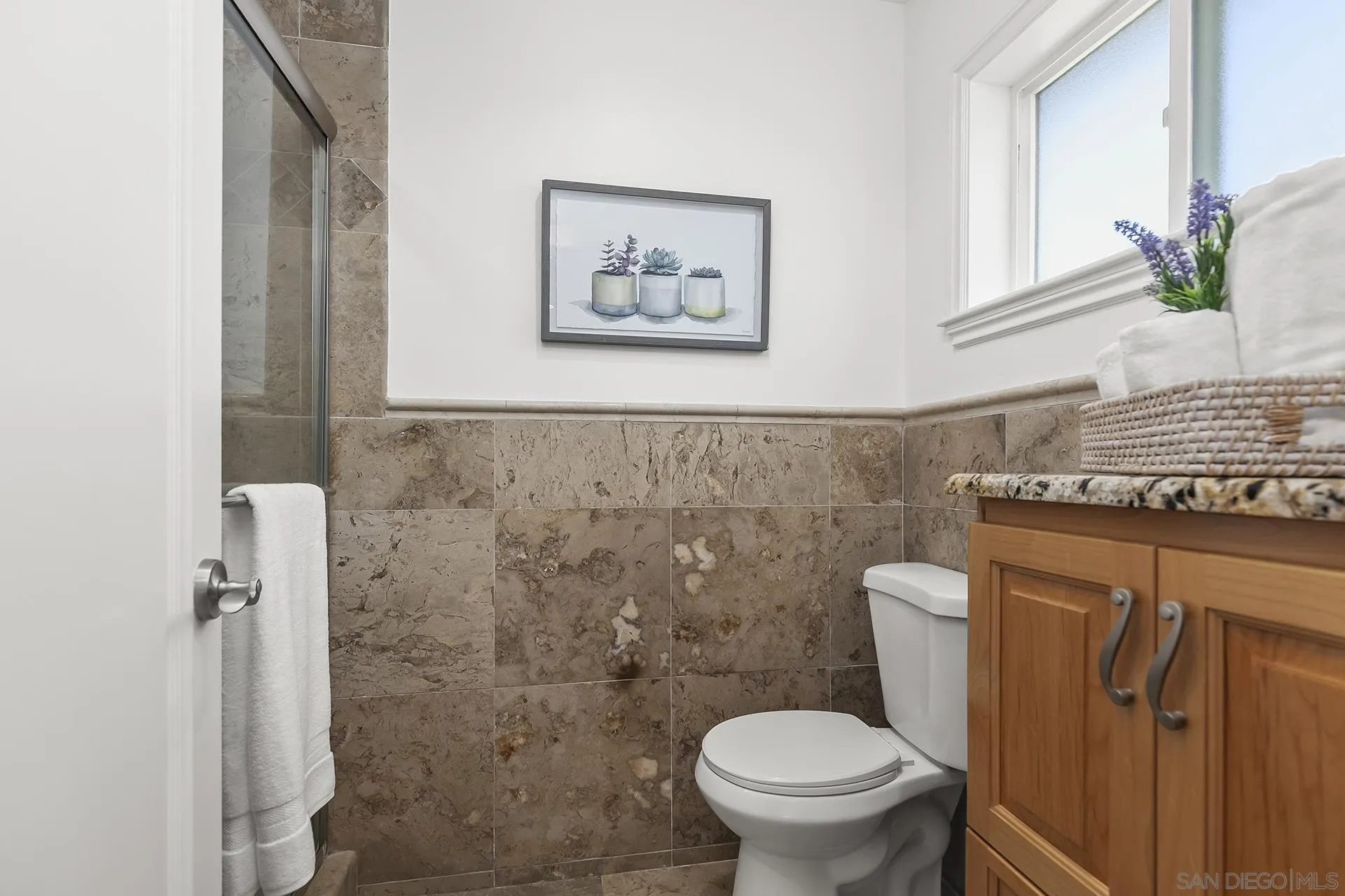 10371 Strathmore Drive Santee, CA 92071 - Photo 27 of 58 a bathroom with a toilet and a sink