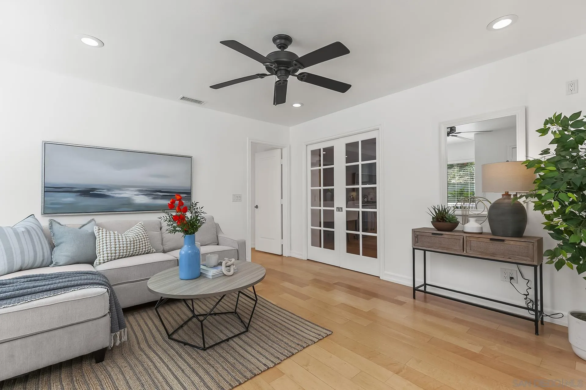 10371 Strathmore Drive Santee, CA 92071 - Photo 28 of 58 a living room with furniture and windows