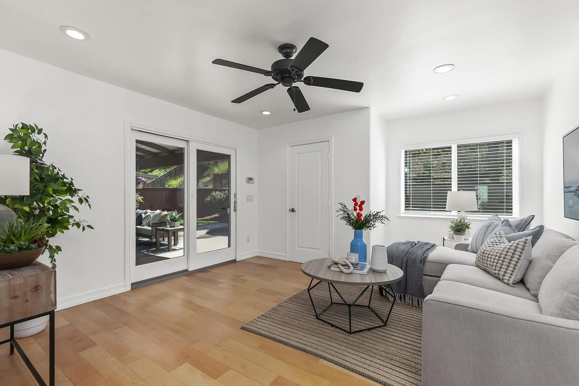 10371 Strathmore Drive Santee, CA 92071 - Photo 29 of 58 a living room with furniture and potted plants