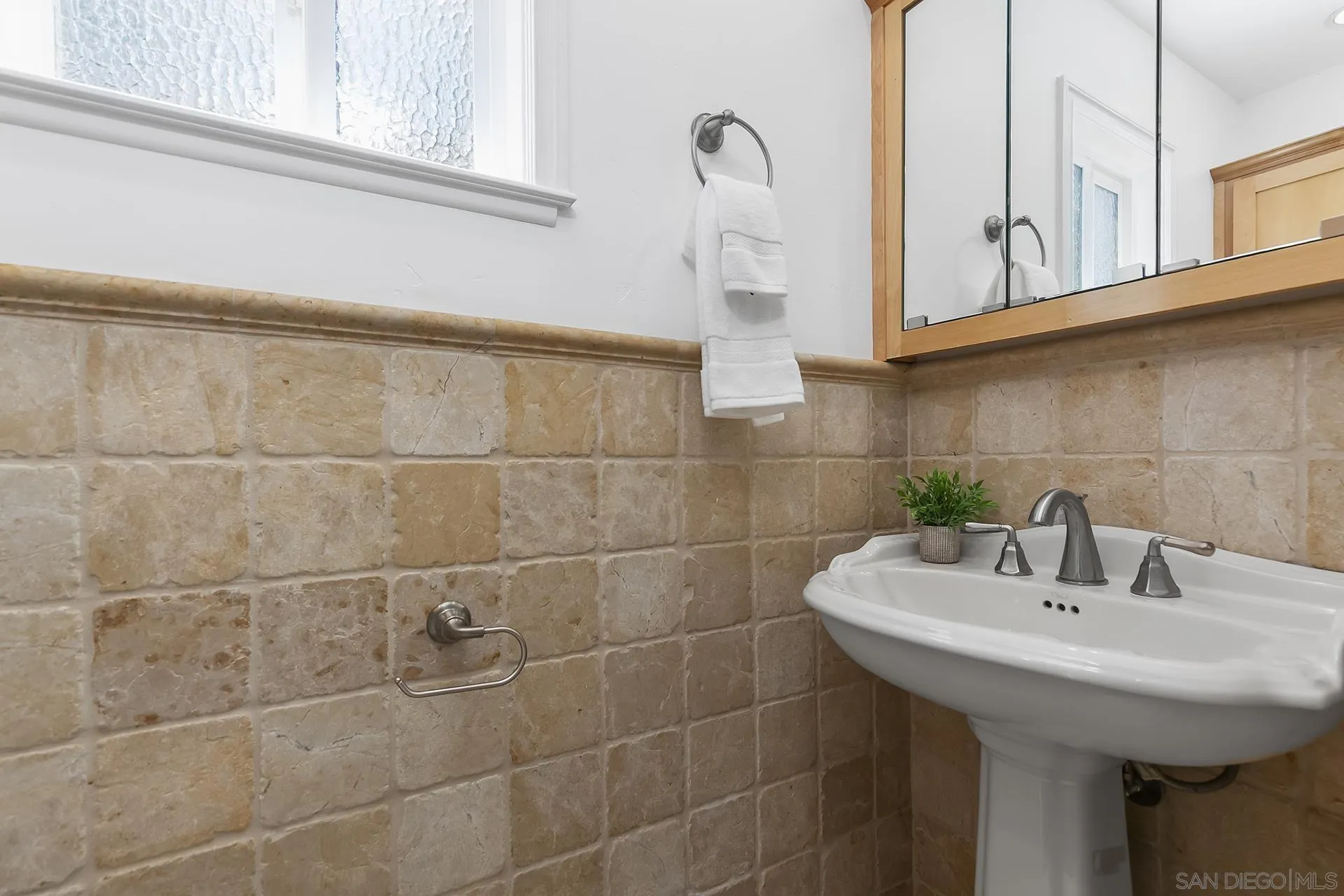 10371 Strathmore Drive Santee, CA 92071 - Photo 30 of 58 a bathroom with a sink and a mirror