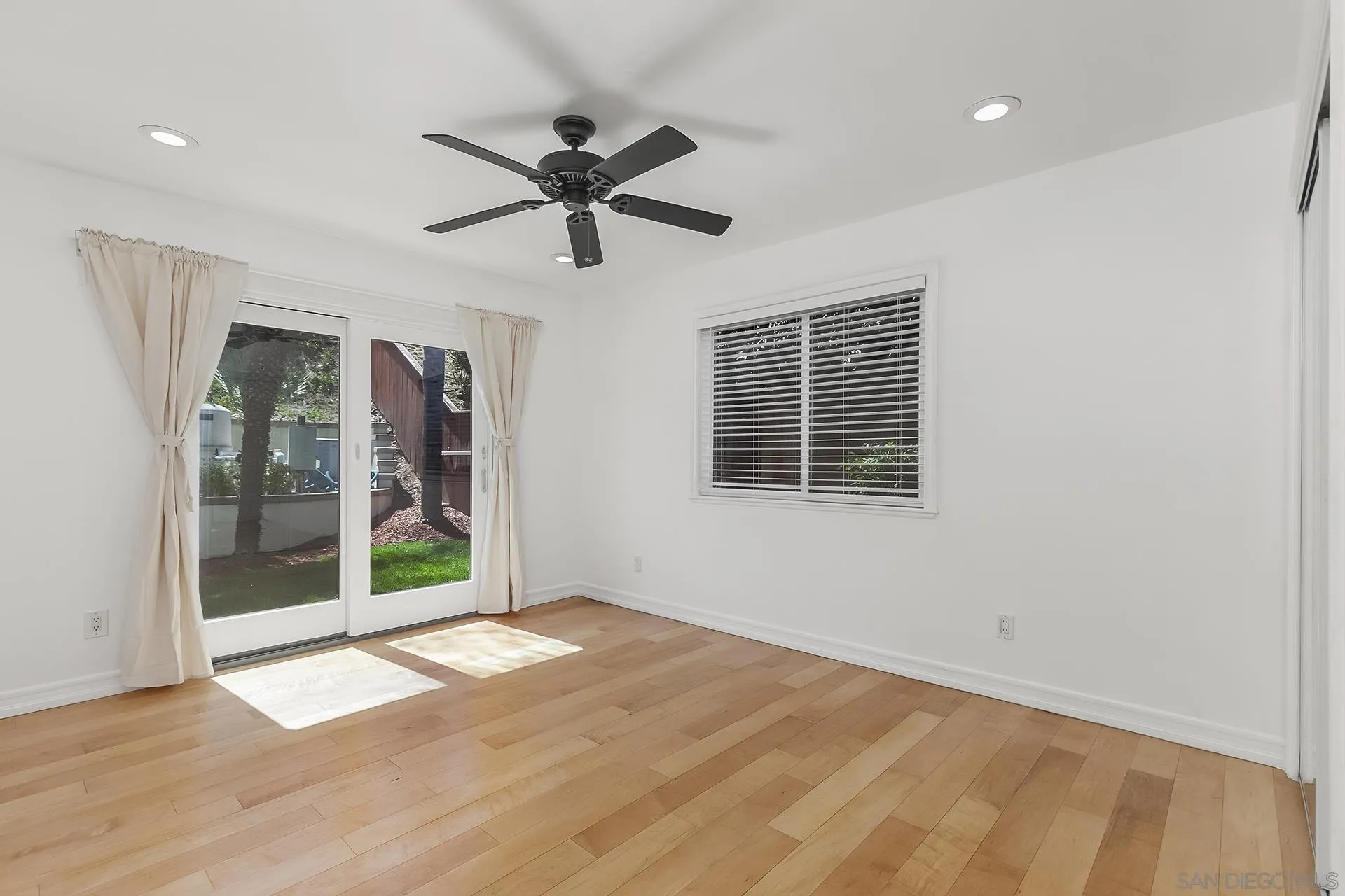10371 Strathmore Drive Santee, CA 92071 - Photo 31 of 58 a view of empty room with wooden floor and fan