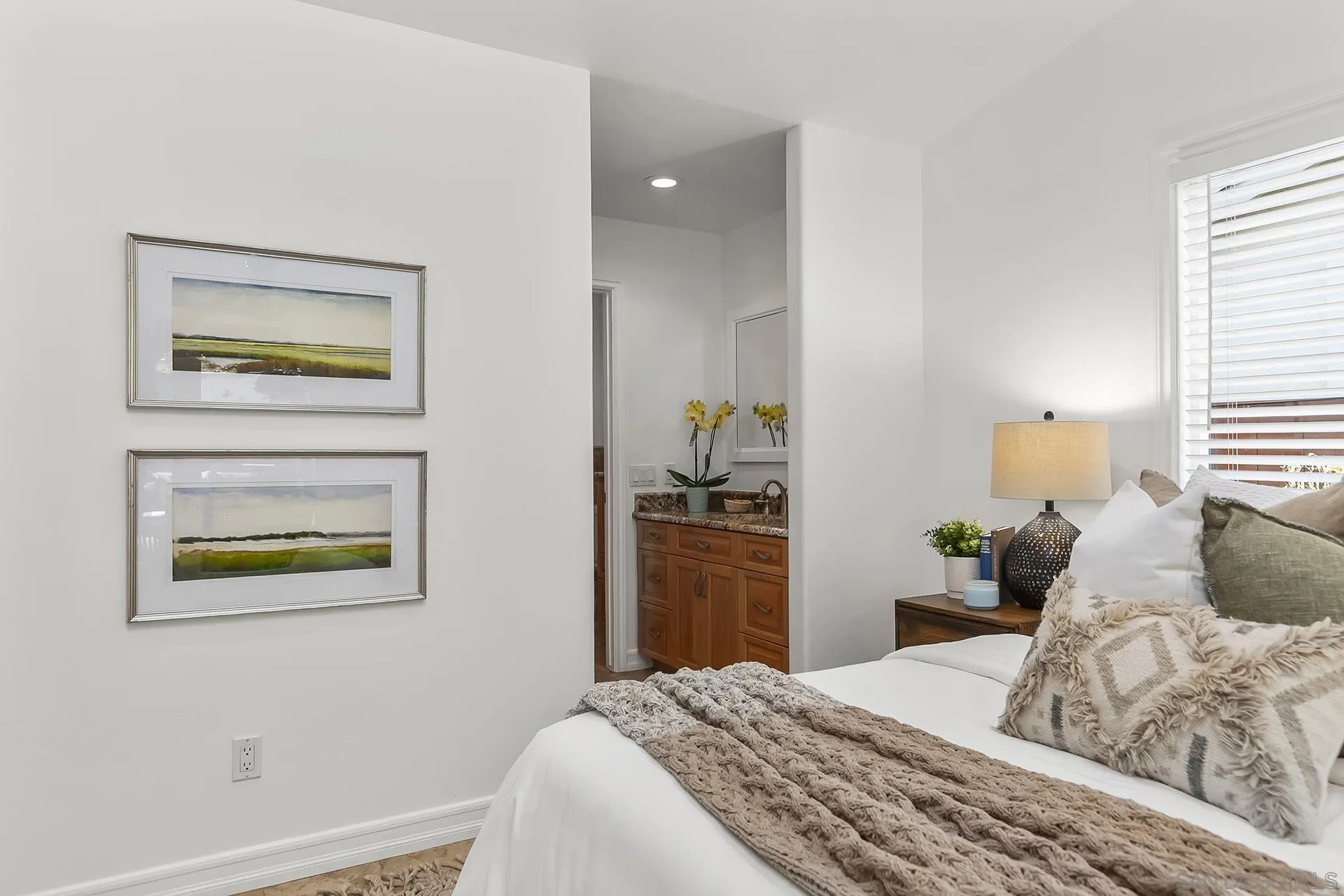 10371 Strathmore Drive Santee, CA 92071 - Photo 33 of 58 a bedroom with a bed and a painting on the wall