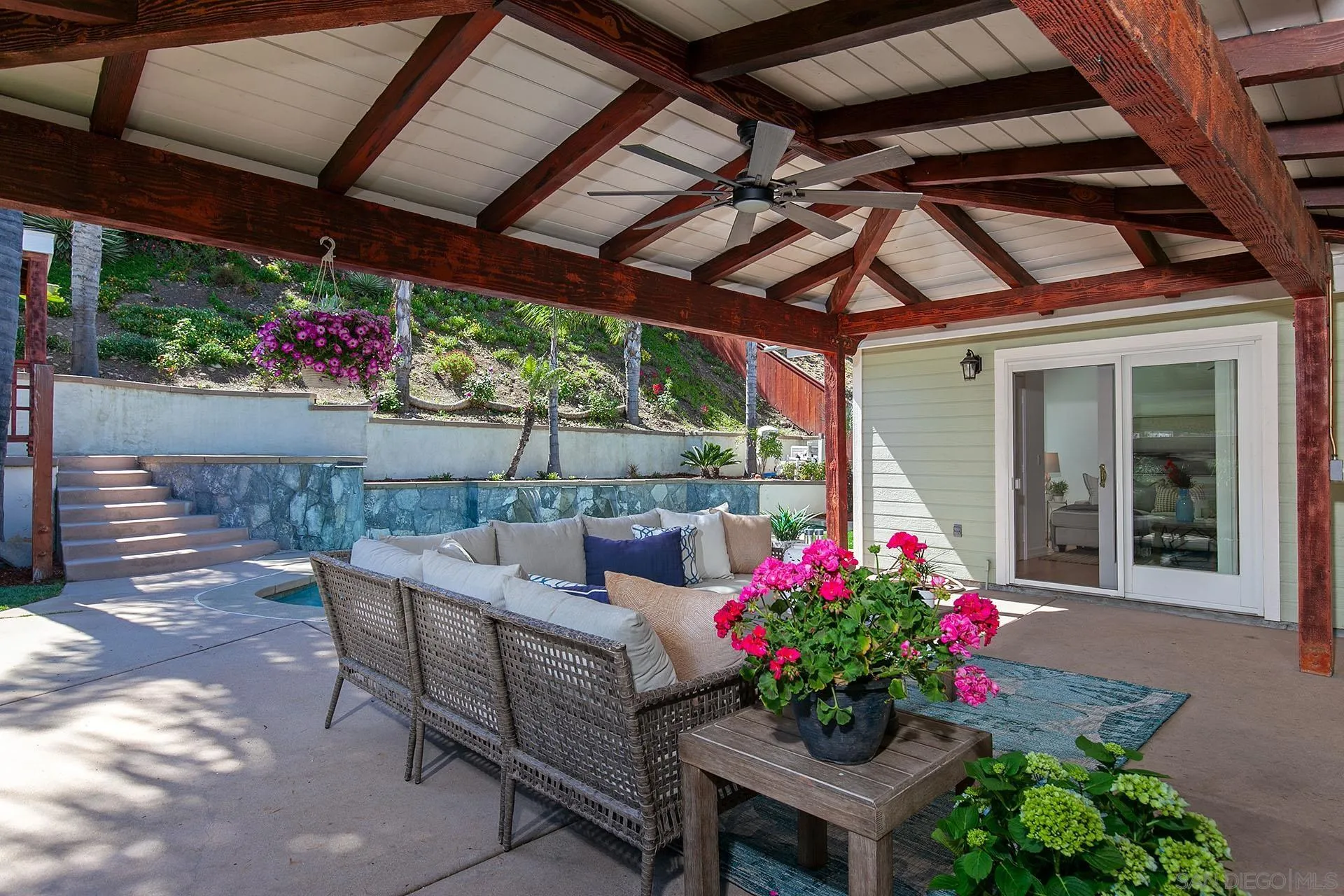 10371 Strathmore Drive Santee, CA 92071 - Photo 42 of 58 a view of a dining room with furniture and flowers