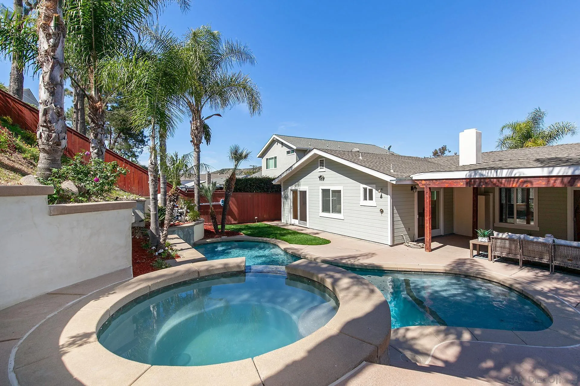 10371 Strathmore Drive Santee, CA 92071 - Photo 48 of 58 a view of a house with swimming pool and sitting area