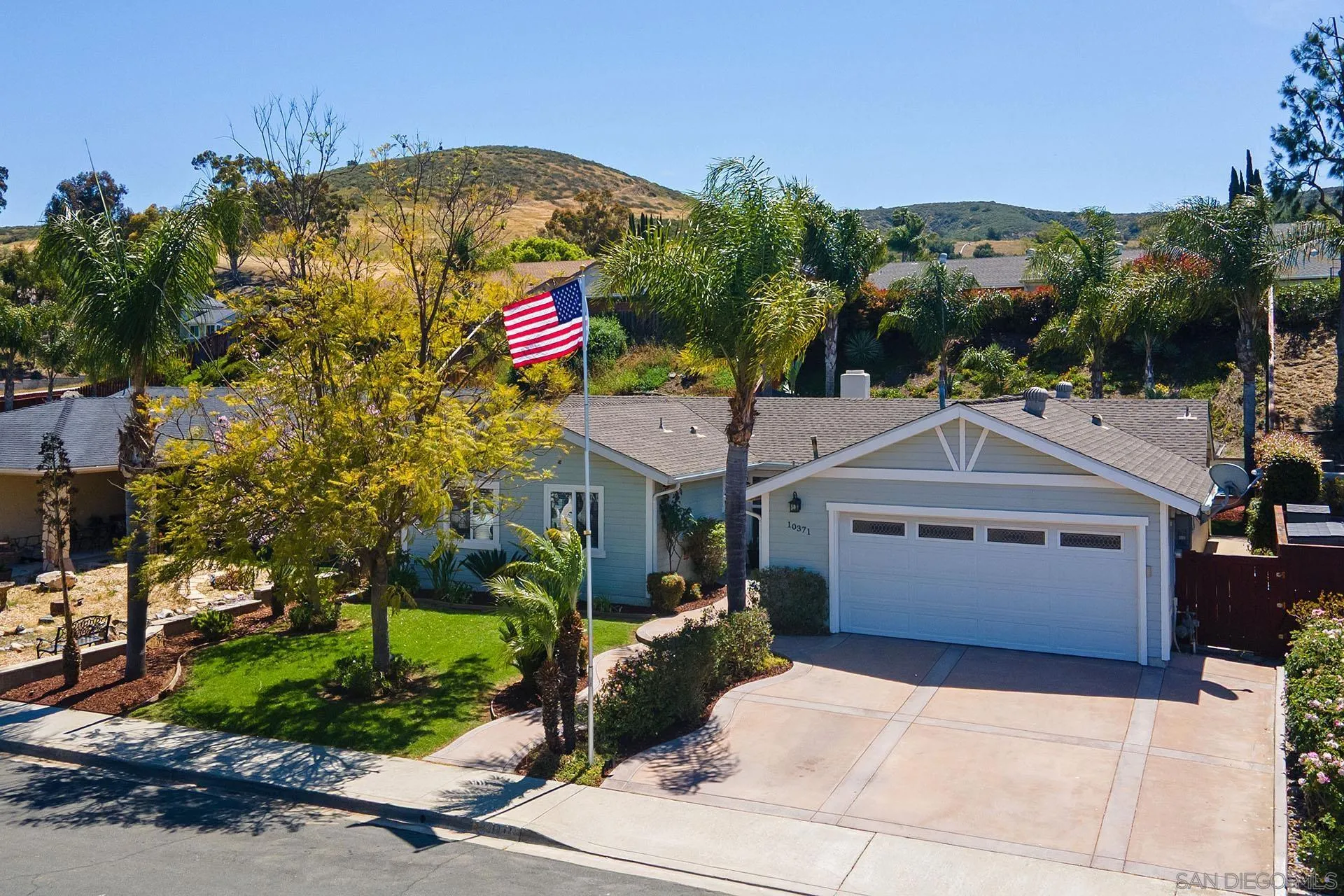10371 Strathmore Drive Santee, CA 92071 - Photo 5 of 58 a front view of a house with a yard