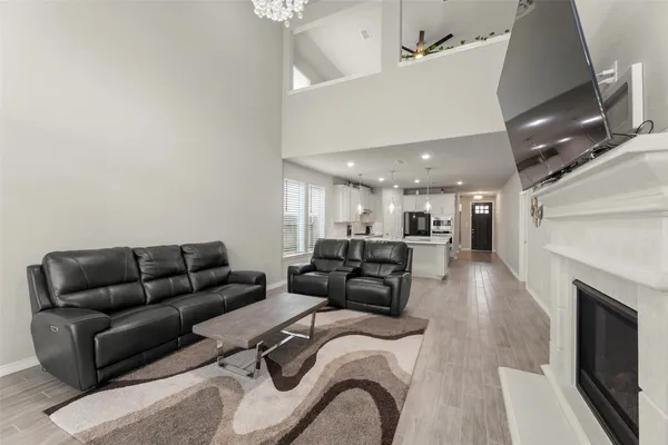 a living room with furniture and a fireplace