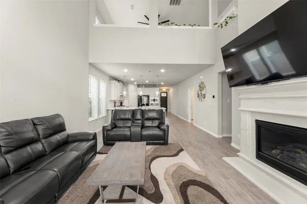 a living room with furniture and a fireplace