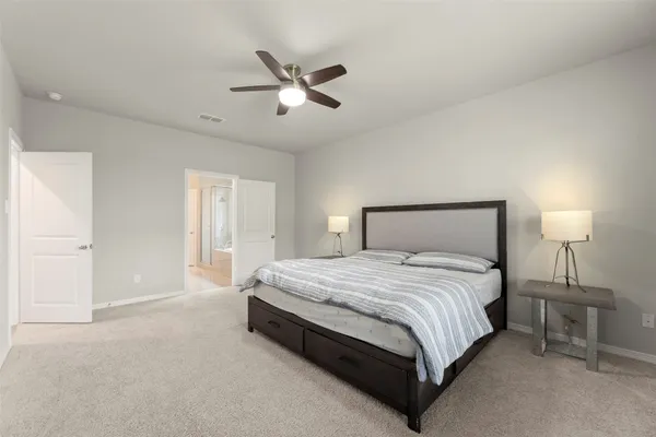 a bedroom with a bed and window