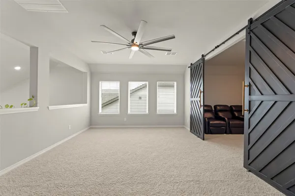 a view of livingroom with hardwood floor and ceiling fan