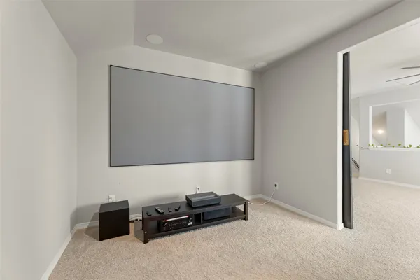 a bedroom with a bed window and a ceiling fan