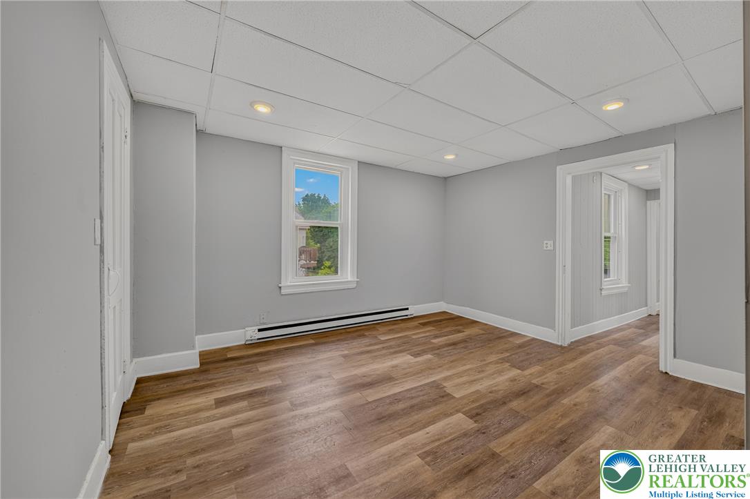 313 Main Street Slatington, PA 18080 - Photo 45 of 73 A versatile room with durable laminate flooring and recessed lighting offers flexible living possibilities.