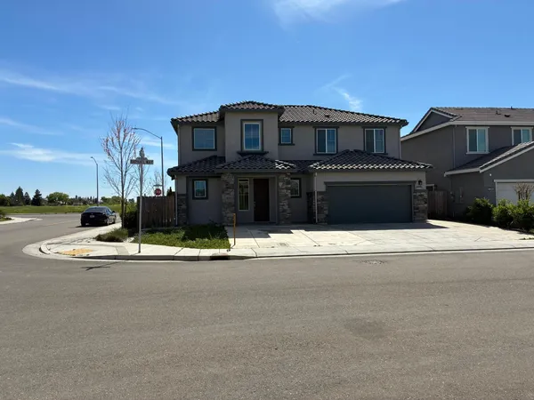 a view of a house with a street