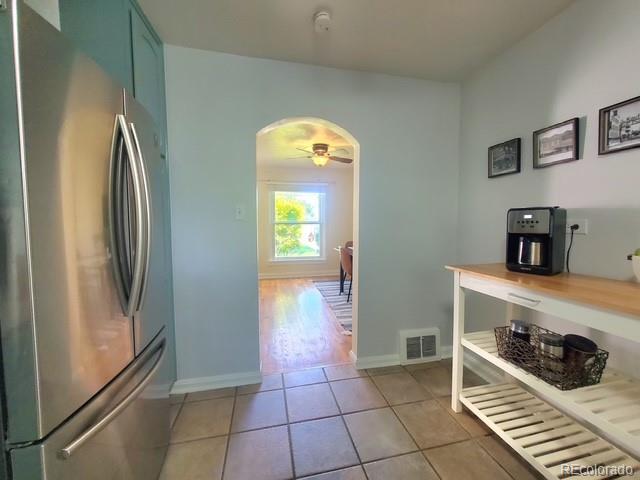6790 West 48th Avenue Wheat Ridge, CO 80033 - Photo 7 of 29 a room with hard wood flooring and decorative lights