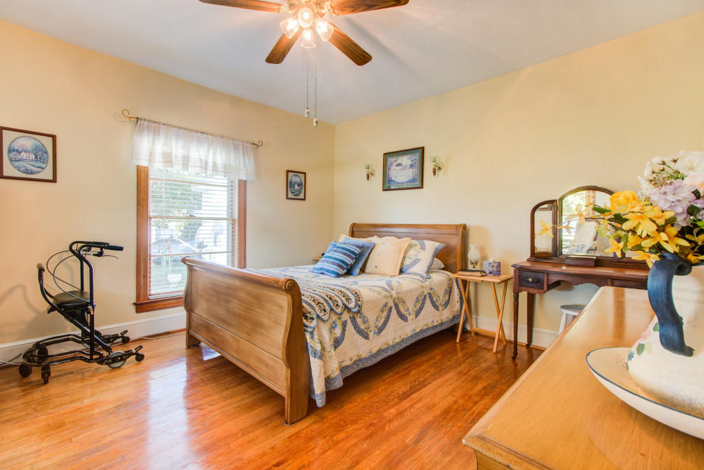 970 Scuffling Hill Road Rocky Mount, VA 24151 - Photo 14 of 33 a bed room with a bed and a chandelier