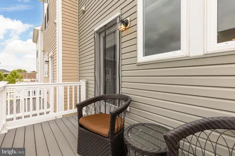 a view of a balcony with furniture
