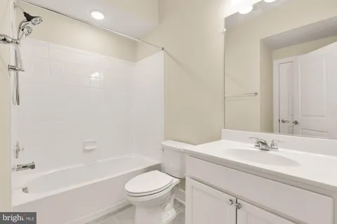a bathroom with a sink a toilet and a bathtub