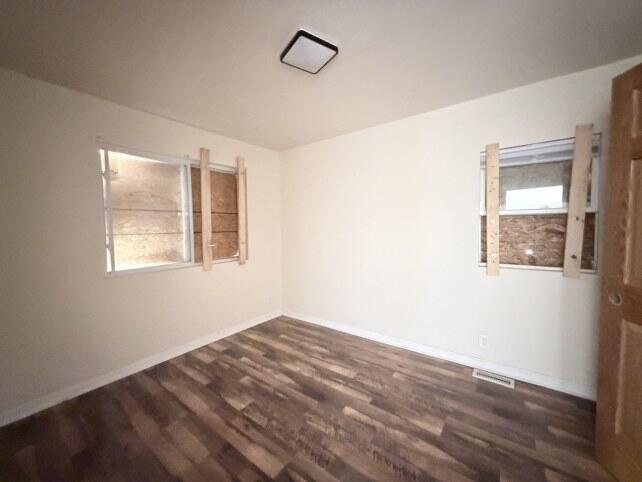 2300 Fillmore Street Gary, IN 46407 - Photo 9 of 16 a view of an empty room with wooden floor and a window