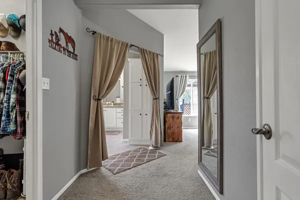 a living room with stainless steel appliances granite countertop furniture and a window