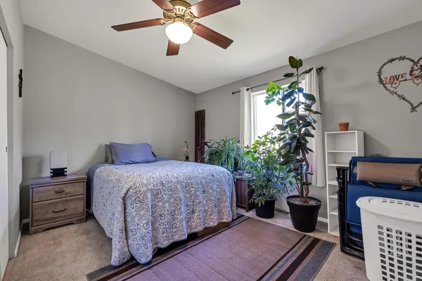 a bedroom with a bed and a shower