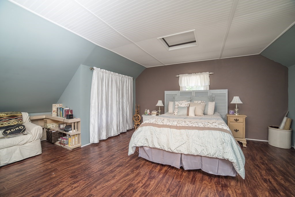 109 Hinsdale Road Northfield, MA 01360 - Photo 15 of 42 a bedroom with a bed and wooden floor