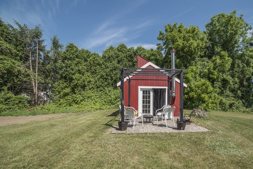 109 Hinsdale Road Northfield, MA 01360 - Photo 30 of 42 a view of a house with backyard porch and sitting area