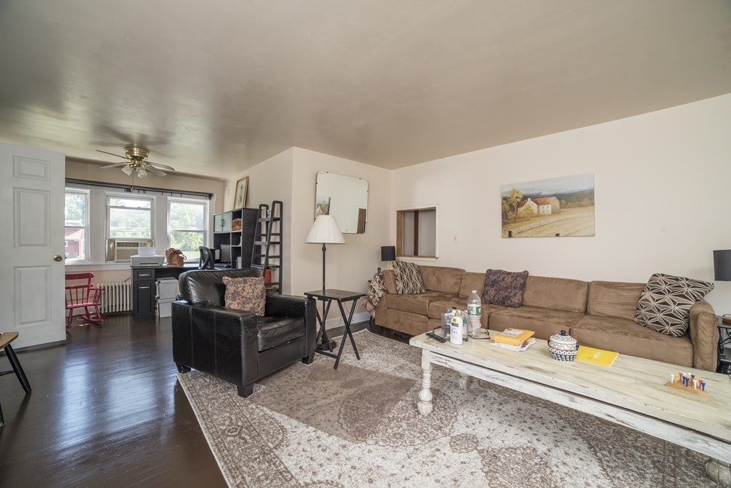109 Hinsdale Road Northfield, MA 01360 - Photo 3 of 42 a living room with furniture or couch and a wooden floor