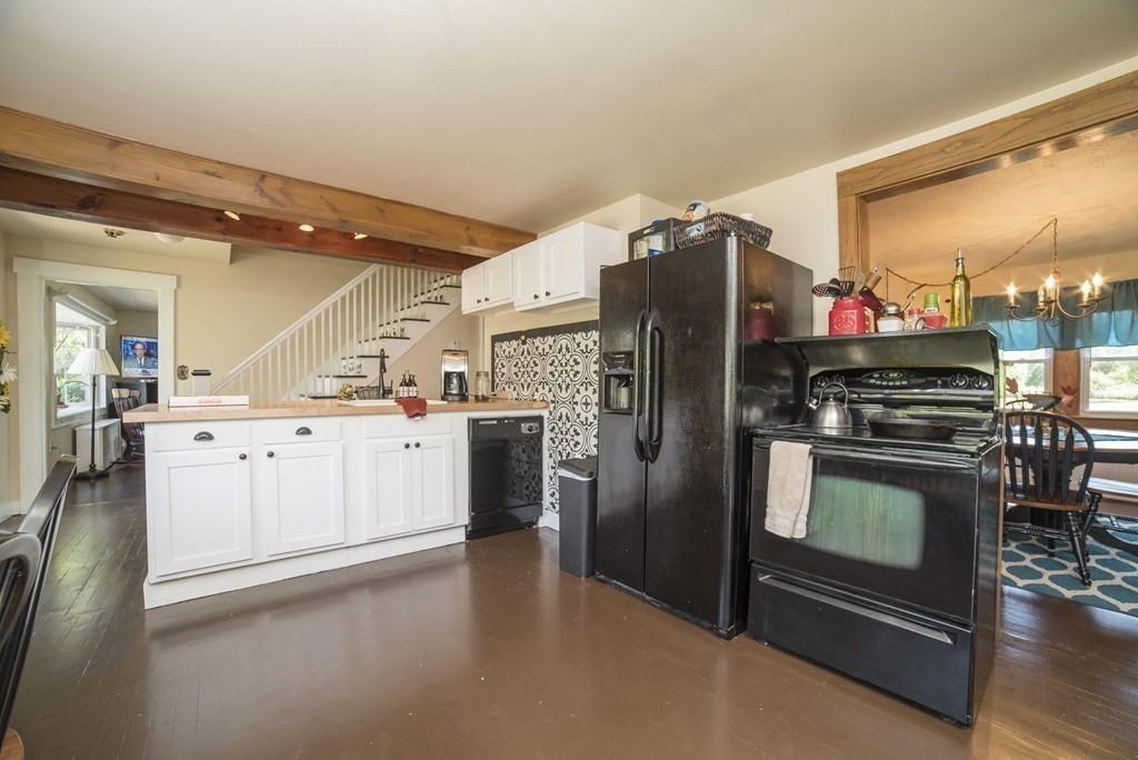 109 Hinsdale Road Northfield, MA 01360 - Photo 8 of 42 a kitchen with stainless steel appliances a stove a sink and a refrigerator