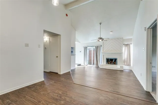 a kitchen with stainless steel appliances granite countertop a refrigerator microwave and stove